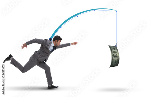 Obraz na plátně Businessman chasing money on fishing rod