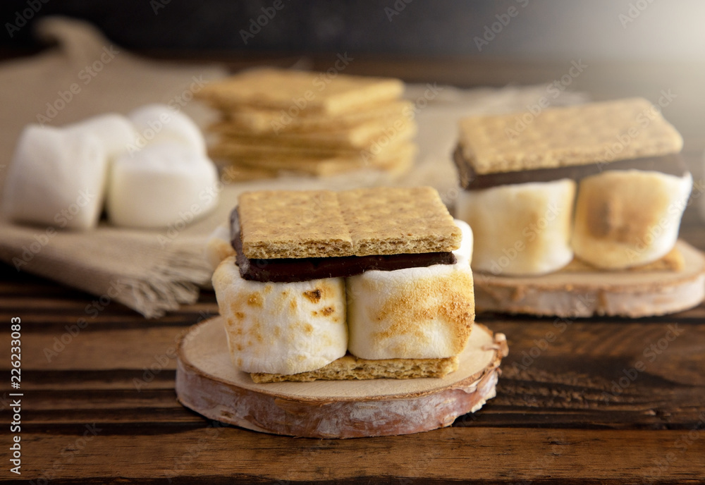 Homemade Smores on a Wooden Table Which are the Perfect Camping Dessert