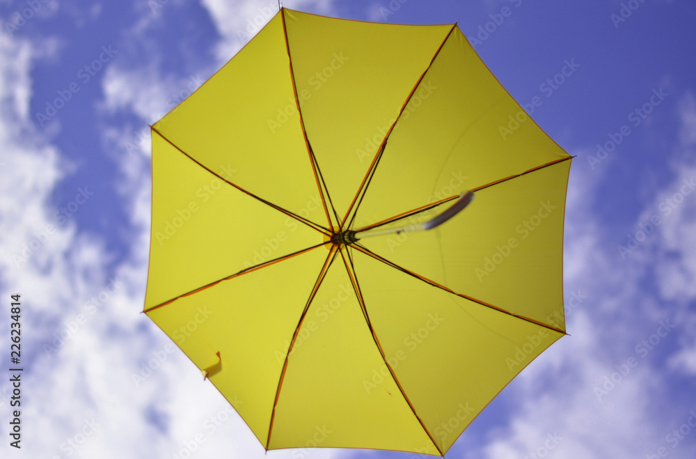 colorful umbrella on background of blue sky