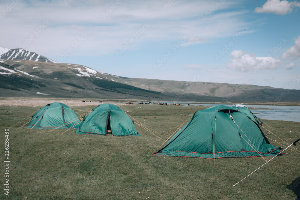 a lot of tourists tents camping in mountains. Mongolia