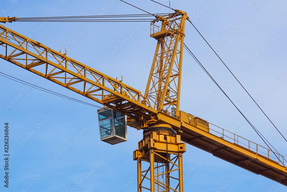 crane tower on sky background at construction site