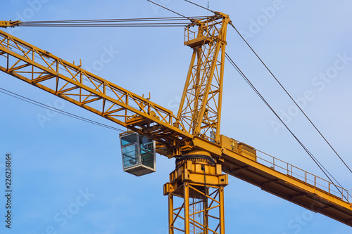 crane tower on sky background at construction site