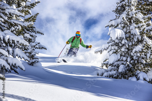 Offpiste skiing in deep powder snow photo