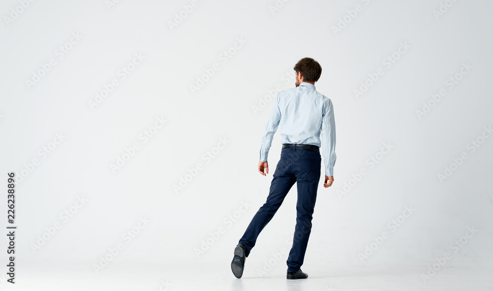 business man stands with his back to camera business man stands with his back to camera