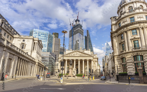 building of Royal Exchange in London near Bank underground station and Aerial view of skyscrapers of the world famous bank district of central London on the background