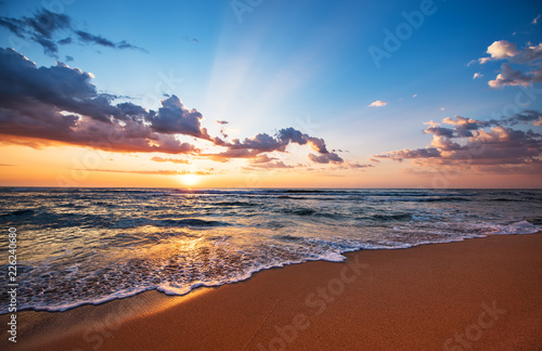 Fototapeta Naklejka Na Ścianę i Meble -  Colorful ocean beach sunrise.