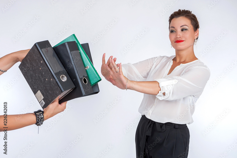 Business woman tired of work. Secretary makes it clear that she has had enough. Business woman posing in the studio. The girl doesn't want to work anymore. Stop working Business woman tired of work. Secretary makes it clear that she has had enough. Business woman posing in the studio. The girl doesn't want to work anymore. Stop working