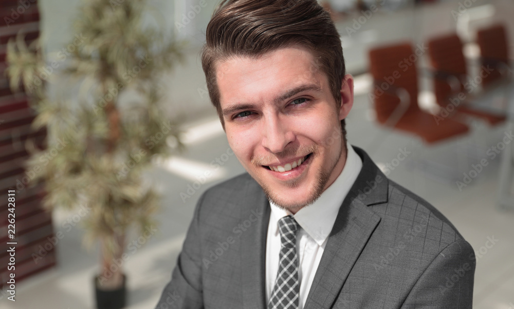 closeup.the face of a successful young man closeup.the face of a successful young man