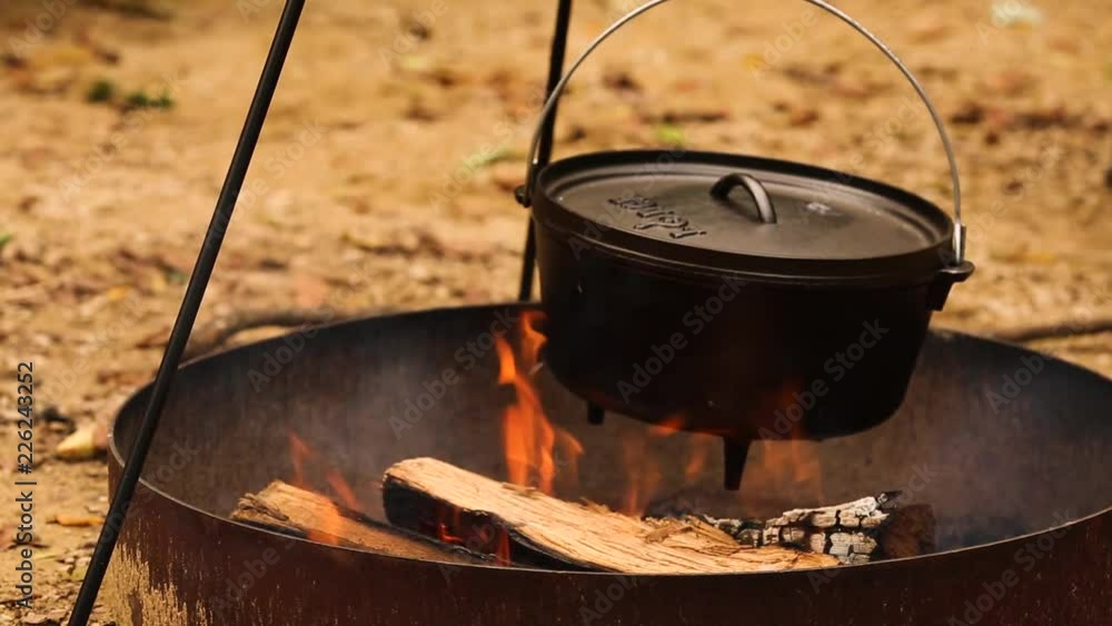cast iron pot cooks over fire cast iron pot cooks over fire