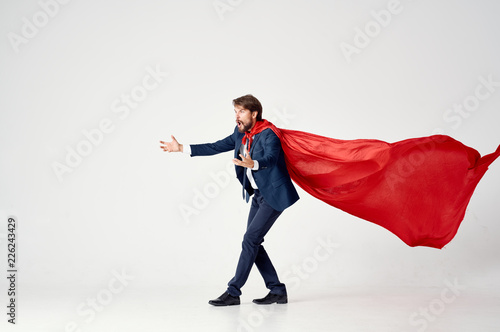 business man in a red cape surprise