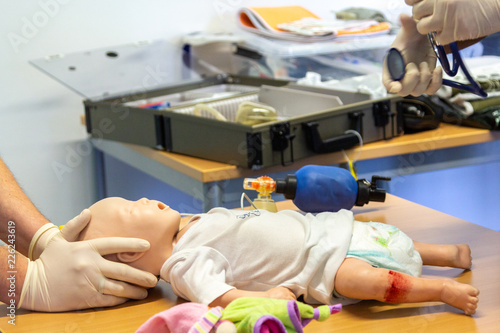 Medical exercise with equipment on a child puppet