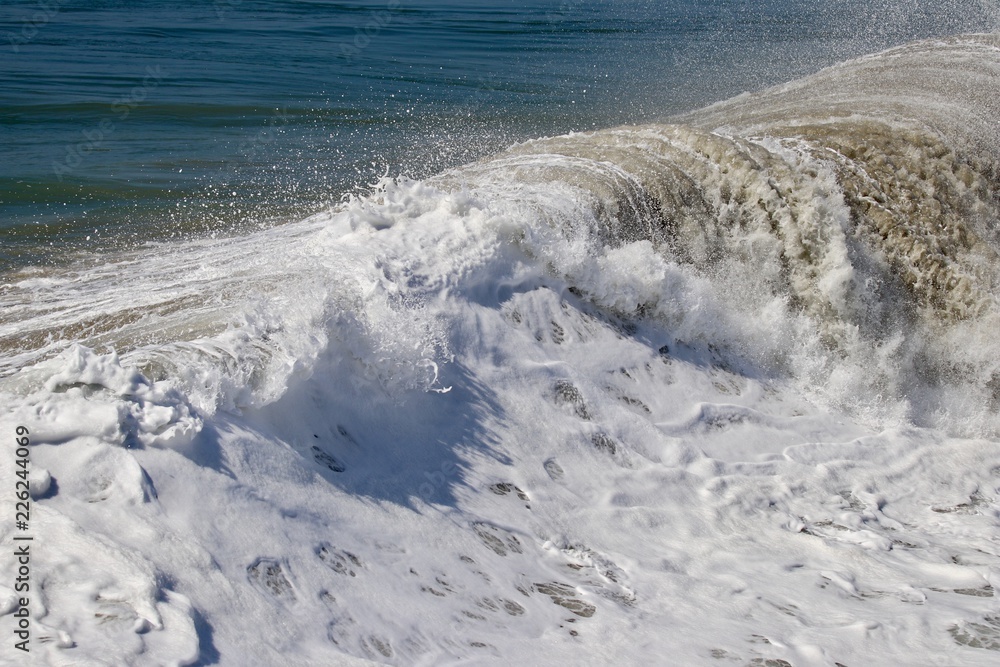 frothy foamy ocean wave close up