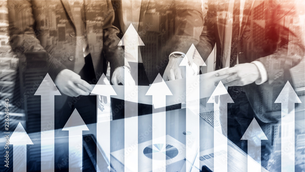 Up arrow graph on skyscraper background. Invesment and financial growth concept. Up arrow graph on skyscraper background. Invesment and financial growth concept.