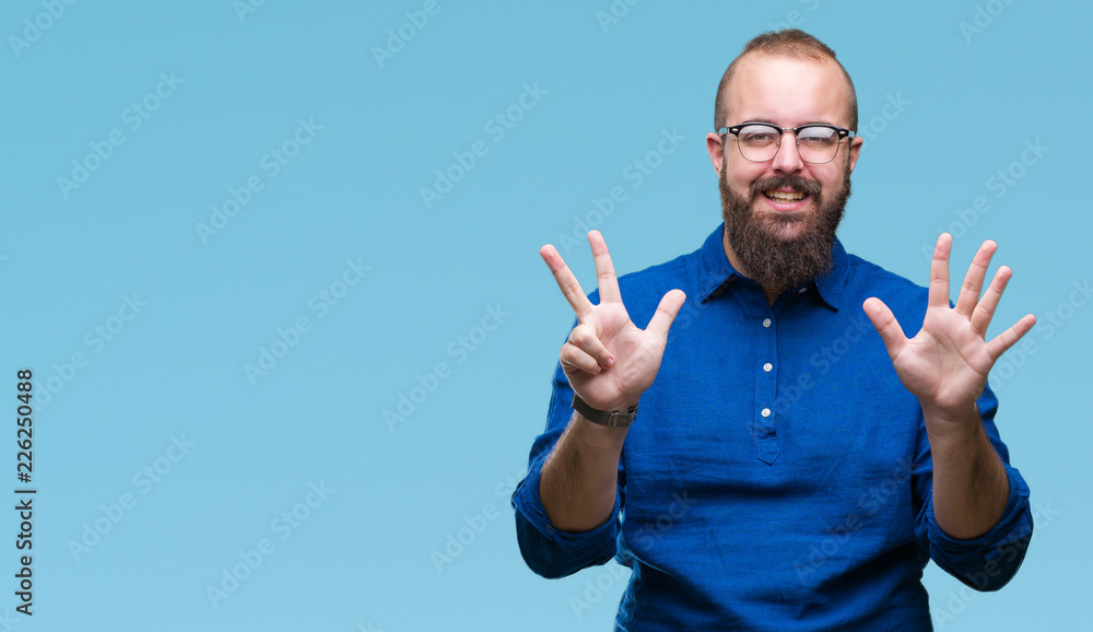 Naklejka premium Young caucasian hipster man wearing glasses over isolated background showing and pointing up with fingers number eight while smiling confident and happy.