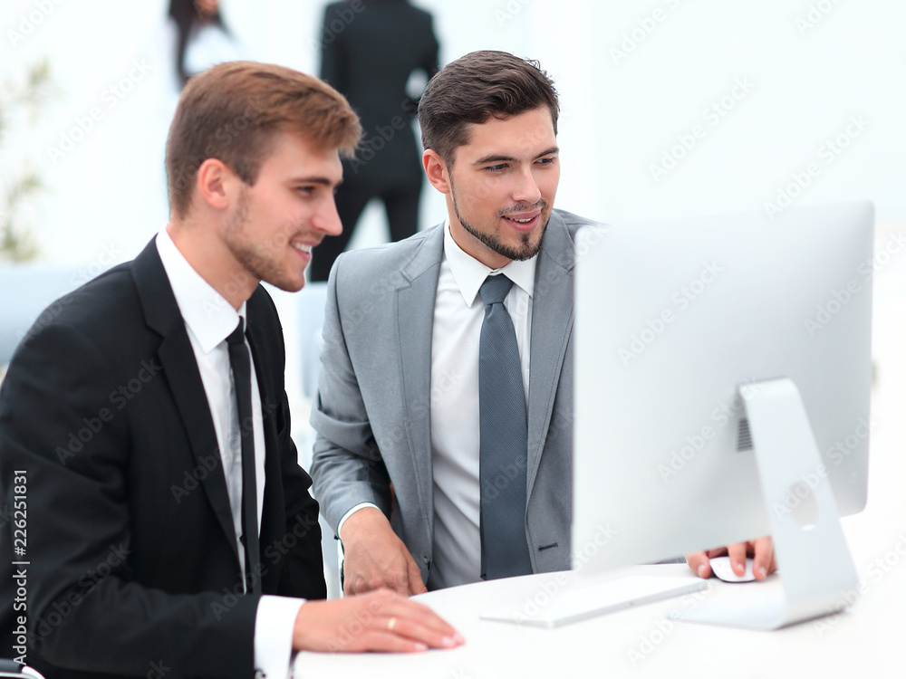 Fototapeta premium employees are talking sitting behind a Desk