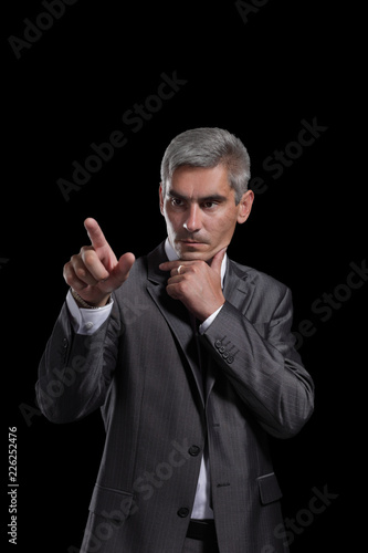 adult businessman pointing at a blank space © ASDF