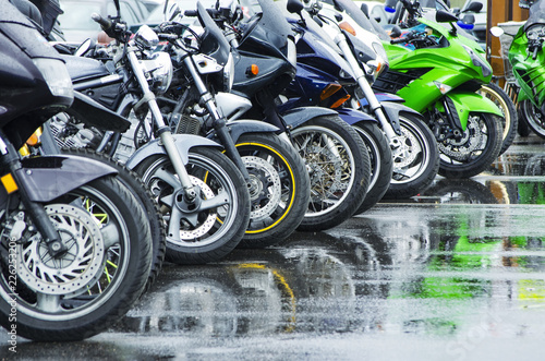motorcycles standing in the row on asphalt closeup