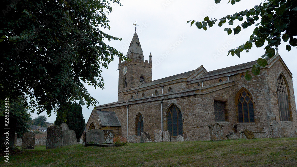 peaceful rural church of the holy cross yard in milton malsor uk