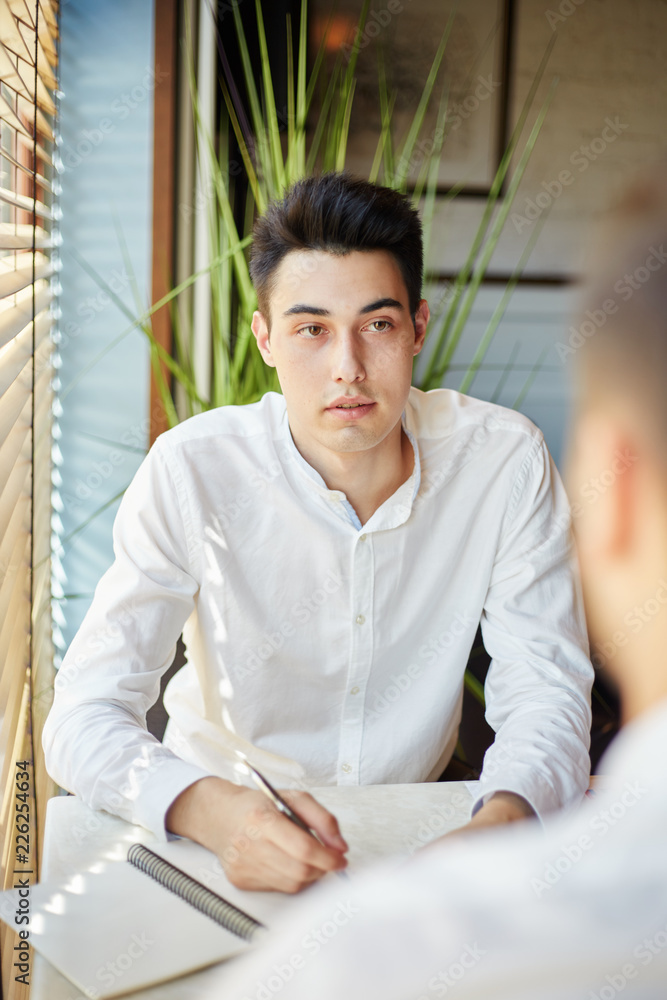 © Comeback Images - Young businessmen having meeting in cafe