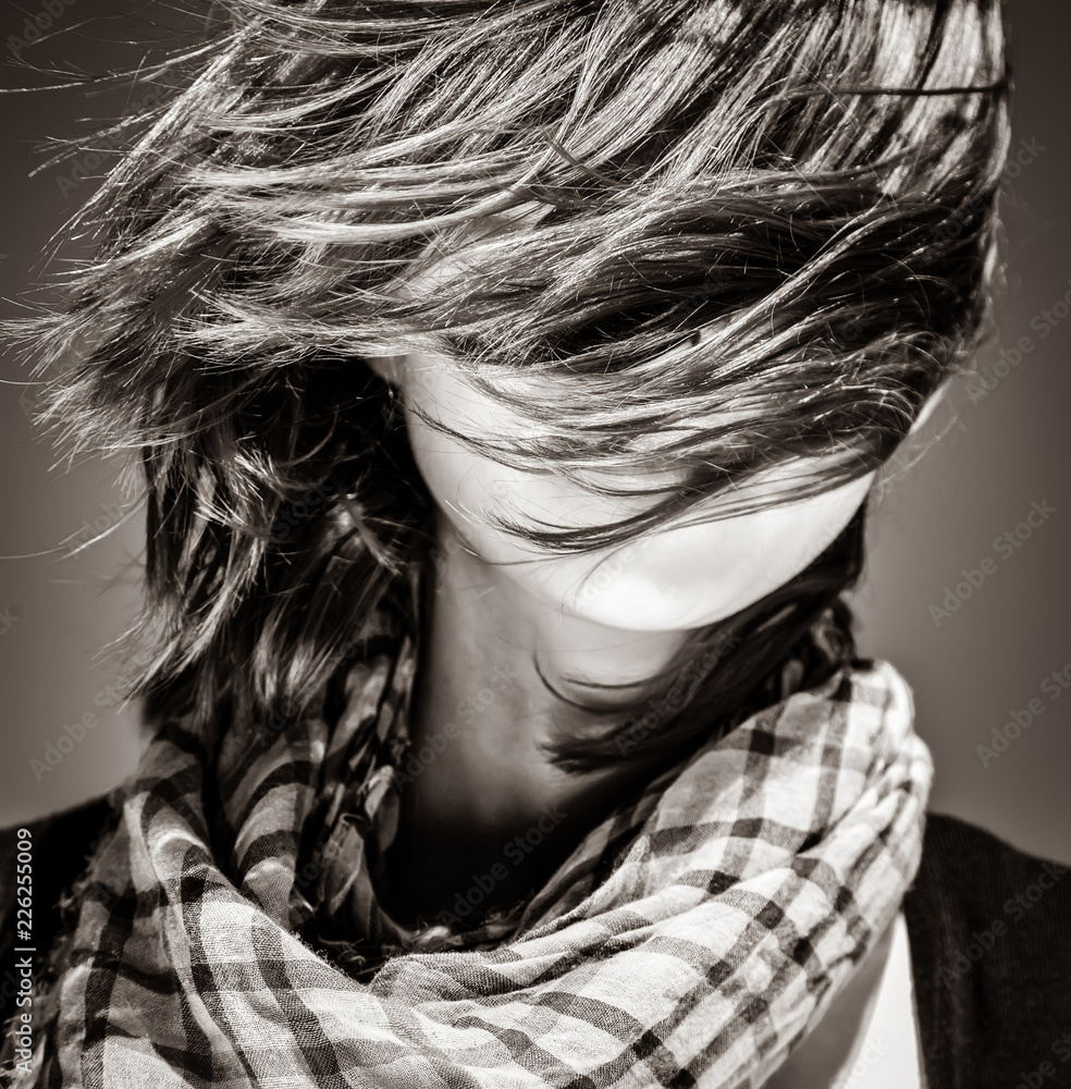 girl with scarf on blue background. Image in black and white style girl with scarf on blue background. Image in black and white style