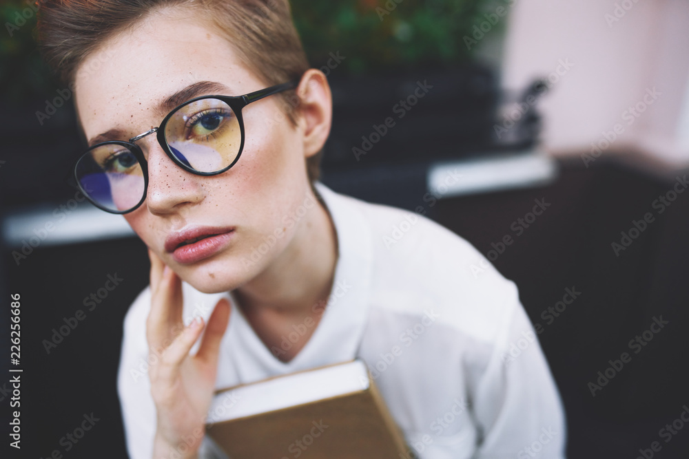business woman in glasses with a notepad portrait business woman in glasses with a notepad portrait