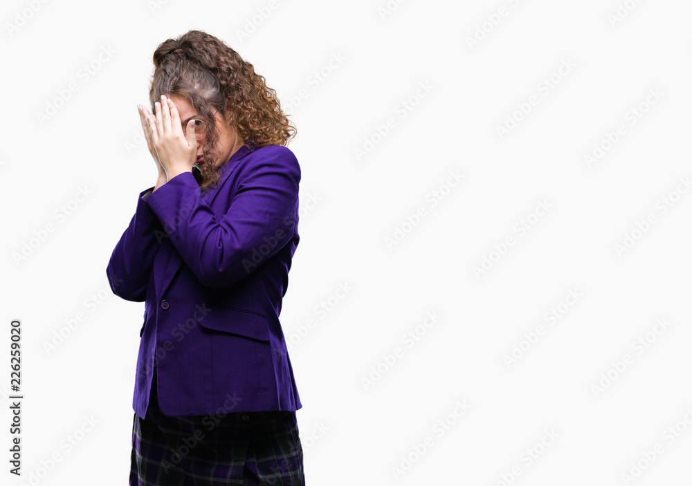 Young brunette student girl wearing school uniform and glasses over isolated background with sad expression covering face with hands while crying. Depression concept. Young brunette student girl wearing school uniform and glasses over isolated background with sad expression covering face with hands while crying. Depression concept.