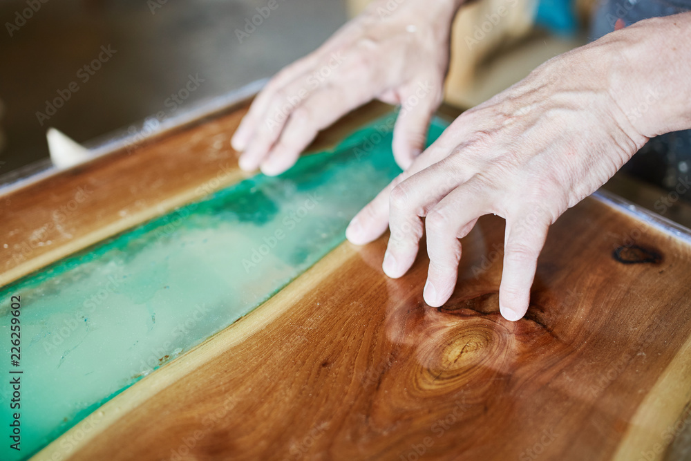 Crop man composing table with resin Crop man composing table with resin