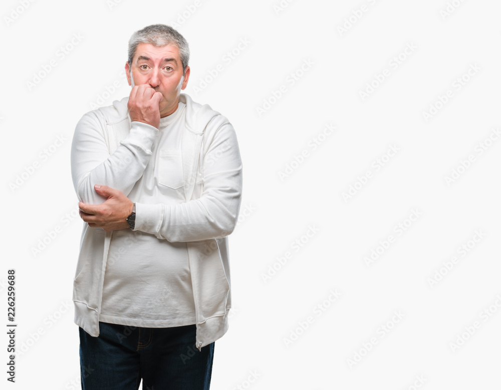 Handsome senior man wearing sport clothes over isolated background looking stressed and nervous with hands on mouth biting nails. Anxiety problem. Handsome senior man wearing sport clothes over isolated background looking stressed and nervous with hands on mouth biting nails. Anxiety problem.