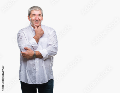 Handsome senior man over isolated background looking confident at the camera with smile with crossed arms and hand raised on chin. Thinking positive.