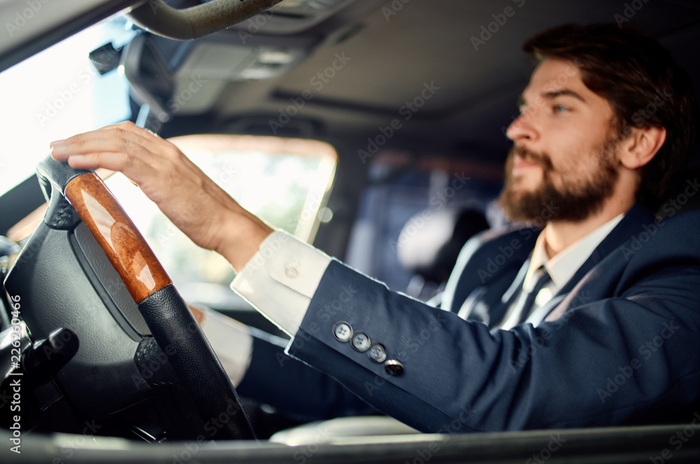 business man driving a car