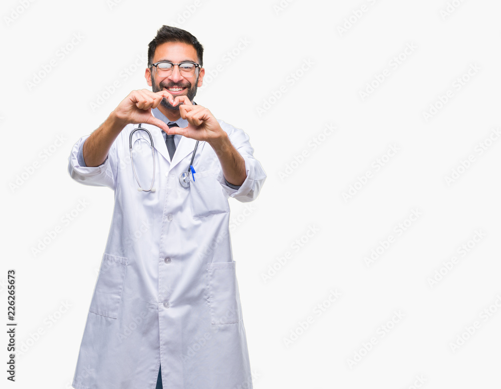 Adult hispanic doctor man over isolated background smiling in love showing heart symbol and shape with hands. Romantic concept. Adult hispanic doctor man over isolated background smiling in love showing heart symbol and shape with hands. Romantic concept.