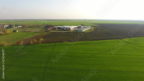 Top view of the village with houses and hangars for the storage of grain. Top view of the village. One can see the roofs of the houses and gardens. Top view of the village with houses and hangars for photo