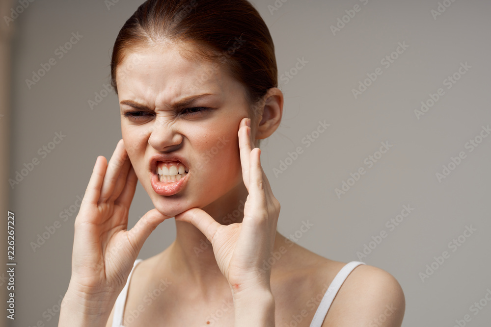 emotional woman touches her face emotional woman touches her face