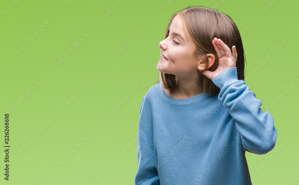 Young beautiful girl wearing winter sweater over isolated background smiling with hand over ear listening an hearing to rumor or gossip. Deafness concept. Young beautiful girl wearing winter sweater over isolated background smiling with hand over ear listening an hearing to rumor or gossip. Deafness concept.
