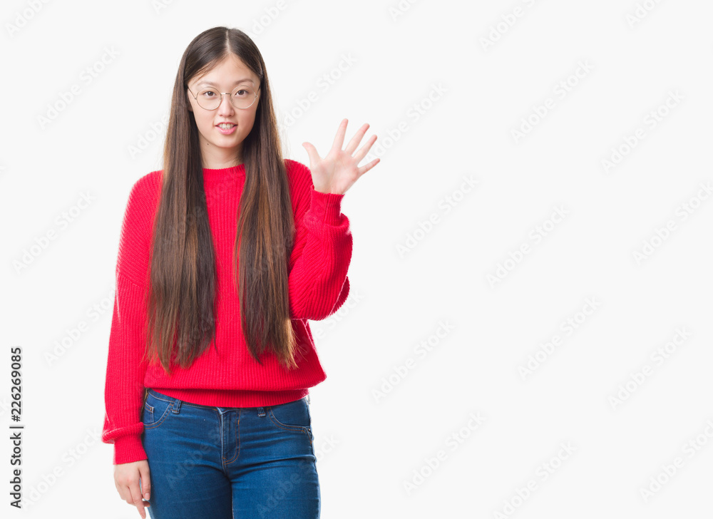 Young Chinese woman over isolated background wearing glasses showing and pointing up with fingers number five while smiling confident and happy. Young Chinese woman over isolated background wearing glasses showing and pointing up with fingers number five while smiling confident and happy.