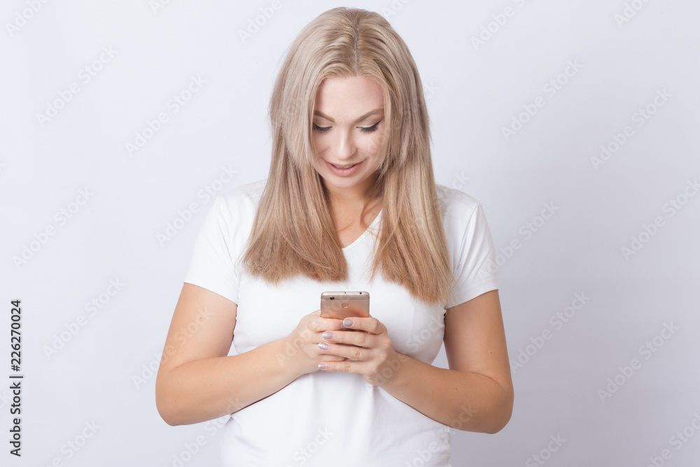 Blonde woman using mobile phone