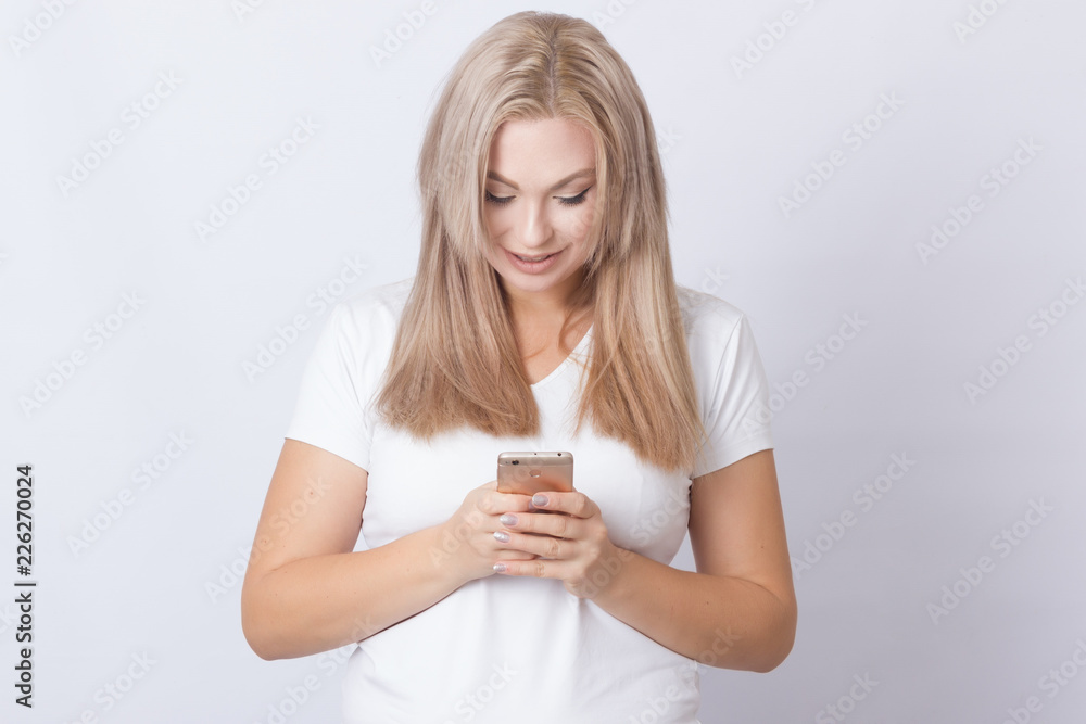 Blonde woman using mobile phone Blonde woman using mobile phone