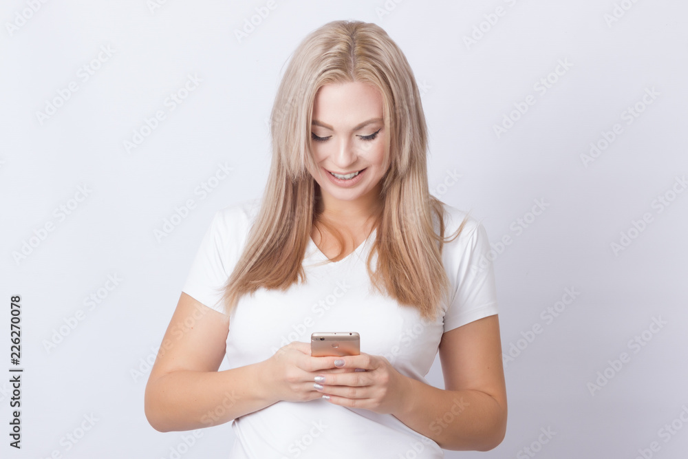 Blonde woman using mobile phone Blonde woman using mobile phone