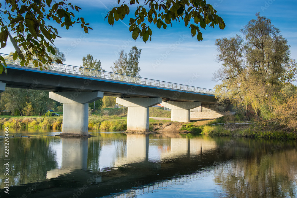 Scenic view of the bridge on reinforced concrete piers at sunset. Scenic view of the bridge on reinforced concrete piers at sunset.