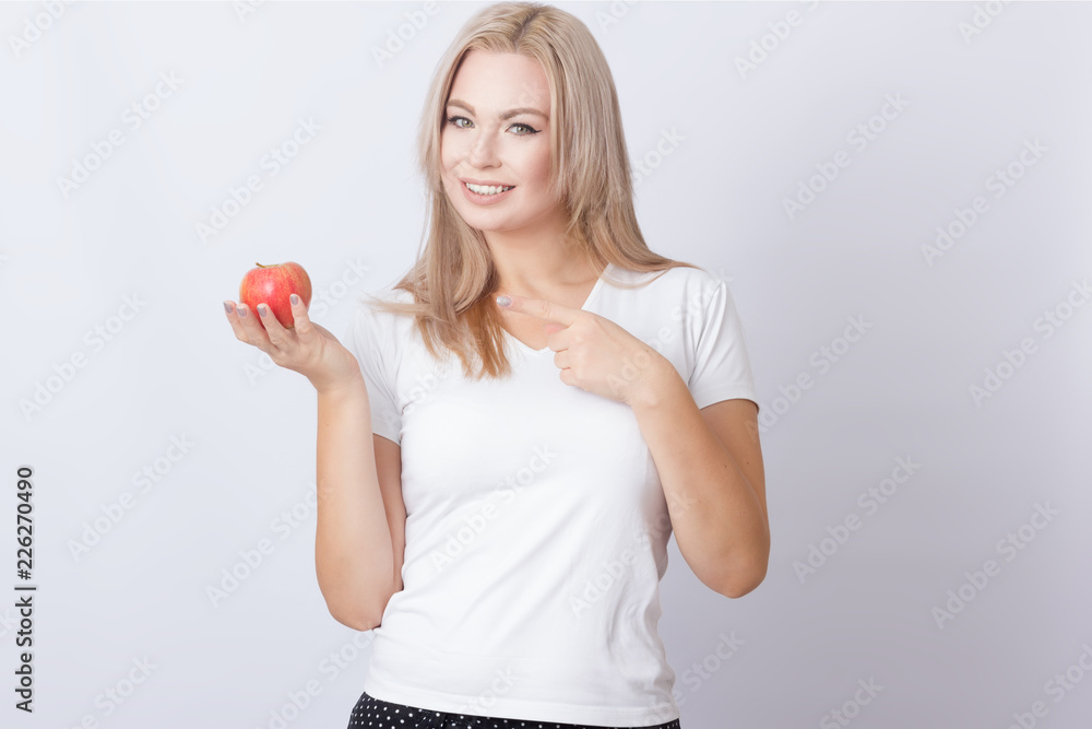 Beautiful blonde woman with apple Beautiful blonde woman with apple