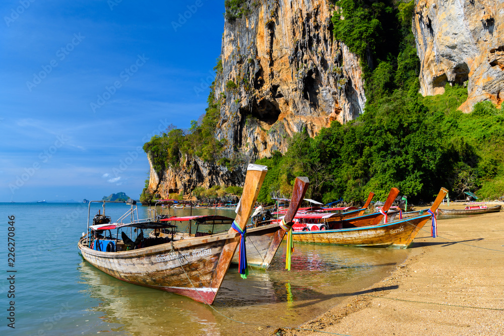 Long tail boat on tropical beach, Tonsai Bay, Railay Beach, Ao N Long tail boat on tropical beach, Tonsai Bay, Railay Beach, Ao N