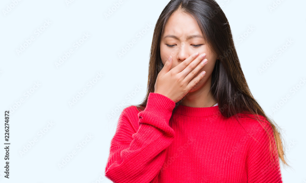 Young asian woman wearing winter sweater over isolated background bored yawning tired covering mouth with hand. Restless and sleepiness. Young asian woman wearing winter sweater over isolated background bored yawning tired covering mouth with hand. Restless and sleepiness.