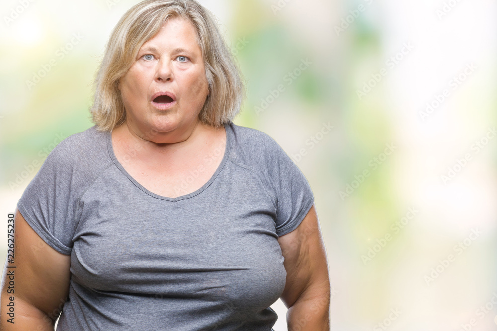 Senior plus size caucasian woman over isolated background afraid and shocked with surprise expression, fear and excited face.