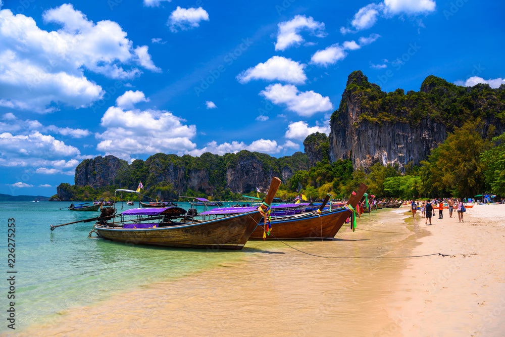 Fototapeta premium Long tail boats and rocks on Railay beach west, Ao Nang, Krabi,