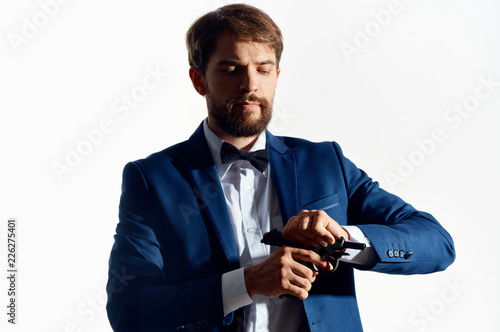 man in a suit reloading a gun © SHOTPRIME STUDIO