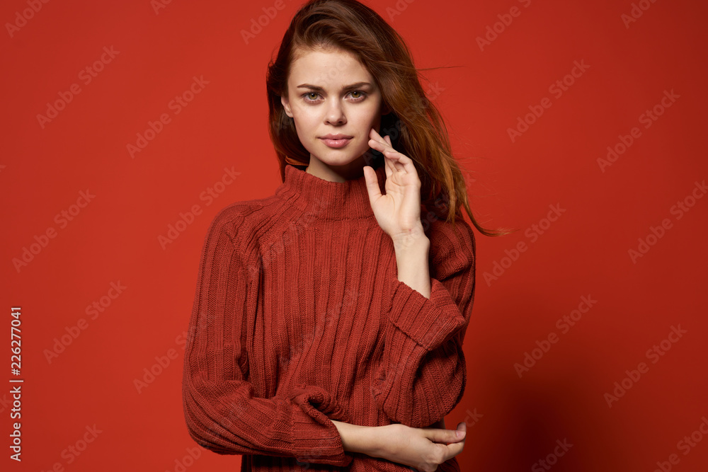 beautiful woman in red sweater over red background beautiful woman in red sweater over red background