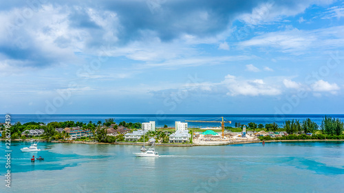 Montego Bay, Jamaica / October 2, 2018 - Pleasure boats and cruise ships enter the harbor at Montego Bay.