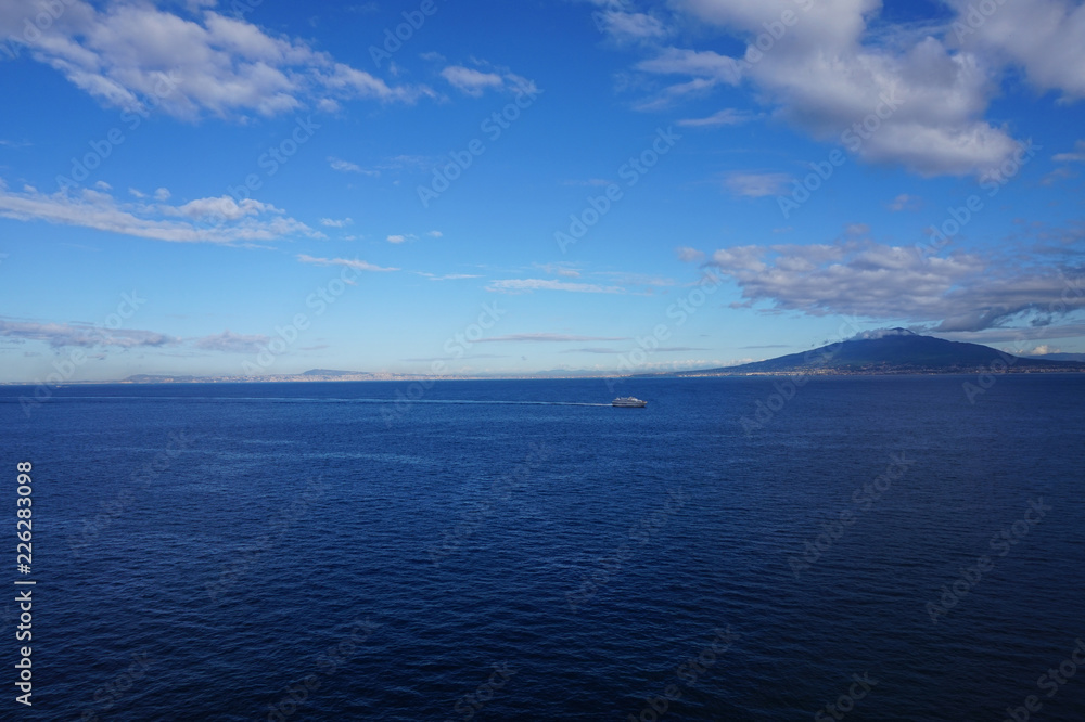 Bay of Naples with a ferry and Mount Vesuvius in the background Bay of Naples with a ferry and Mount Vesuvius in the background