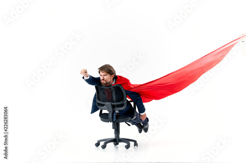 man lies on a chair with a red sheet
