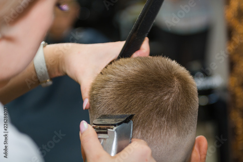 Make a fashionable haircut for children in the barbershop